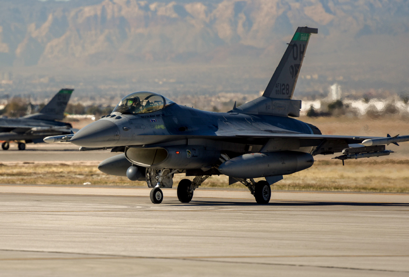 Strike fighter jet on a runway.